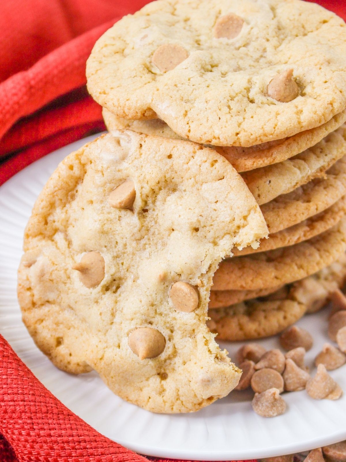 stacked peanut butter cookies with bite taken in one.