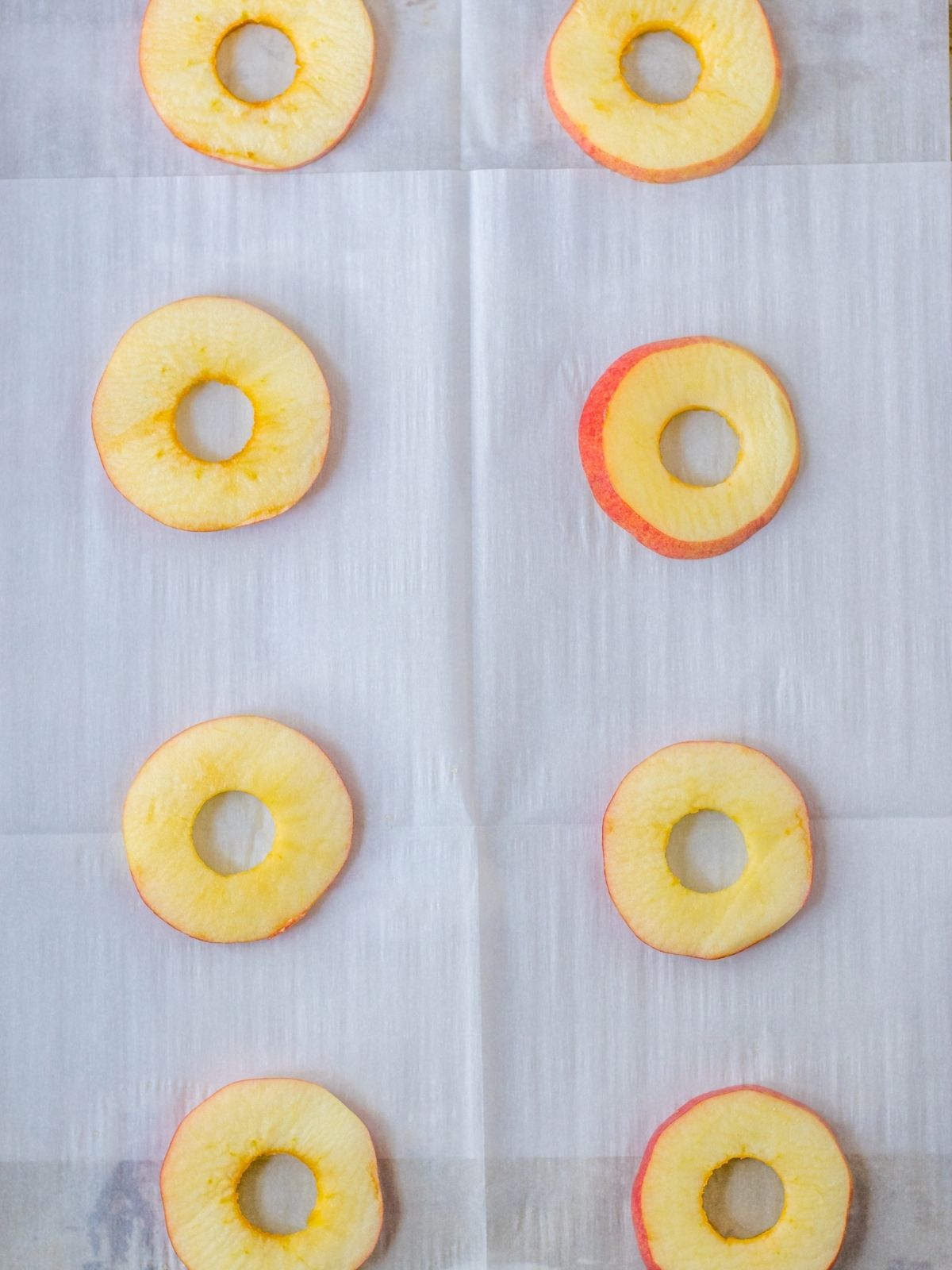 apple slices on parchment paper.