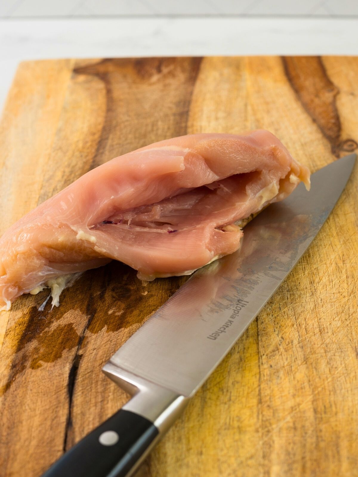 boneless chicken breast with pocket cut in the side.