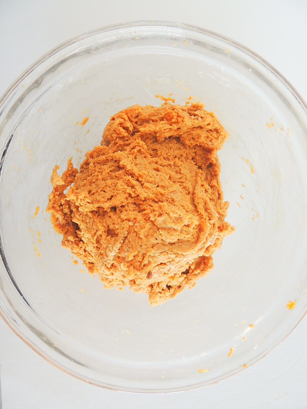 homemade pumpkin donut batter in bowl.