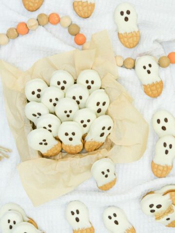 Peanut Butter cookies decorated as ghosts.