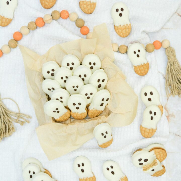 Peanut Butter cookies decorated as ghosts.