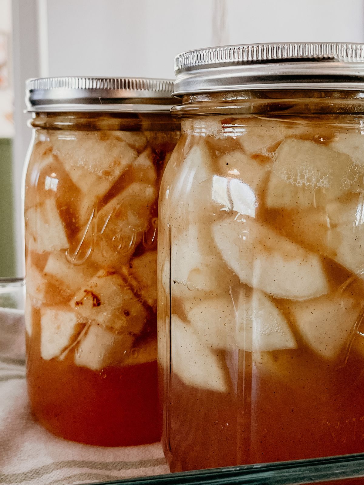 mason jars with apple pie filling.