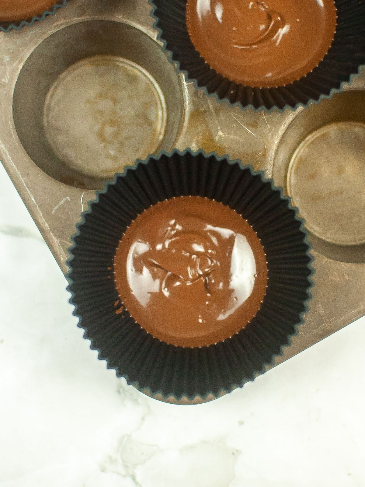 melted chocolate in silicone cups.