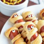 Hot dogs wrapped in crescent roll dough to look like mummies.