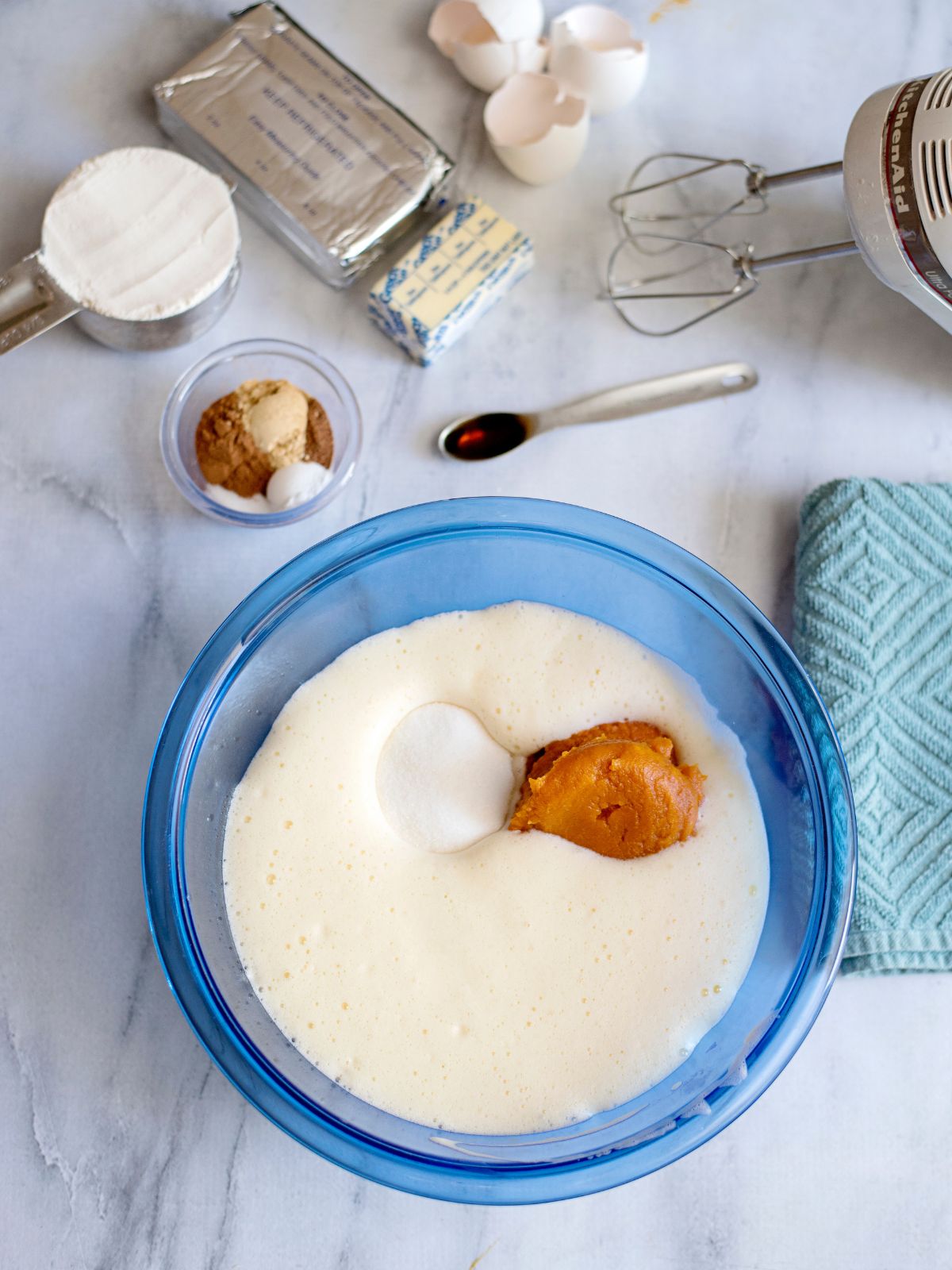 add pumpkin to wet ingredients in bowl.