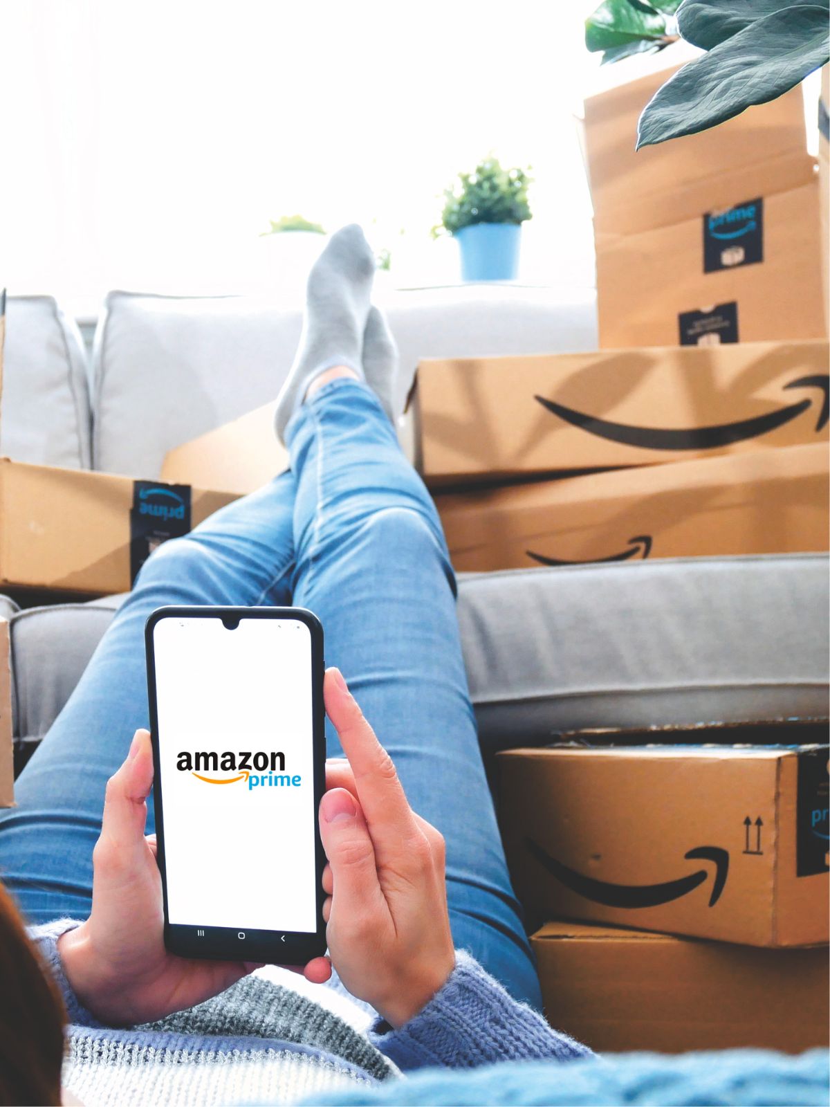 Amazon shopping with boxes and cell phone.