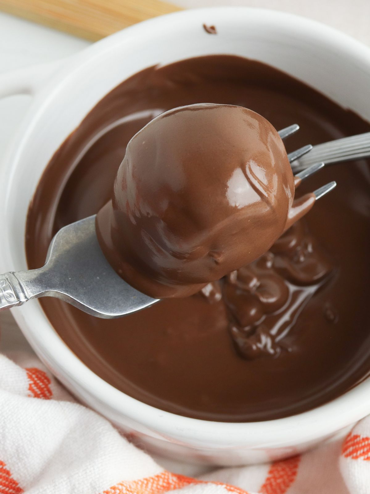 dipped Oreo Truffle in melted chocolate.