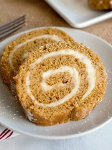 slices of pumpkin roll on a white plate
