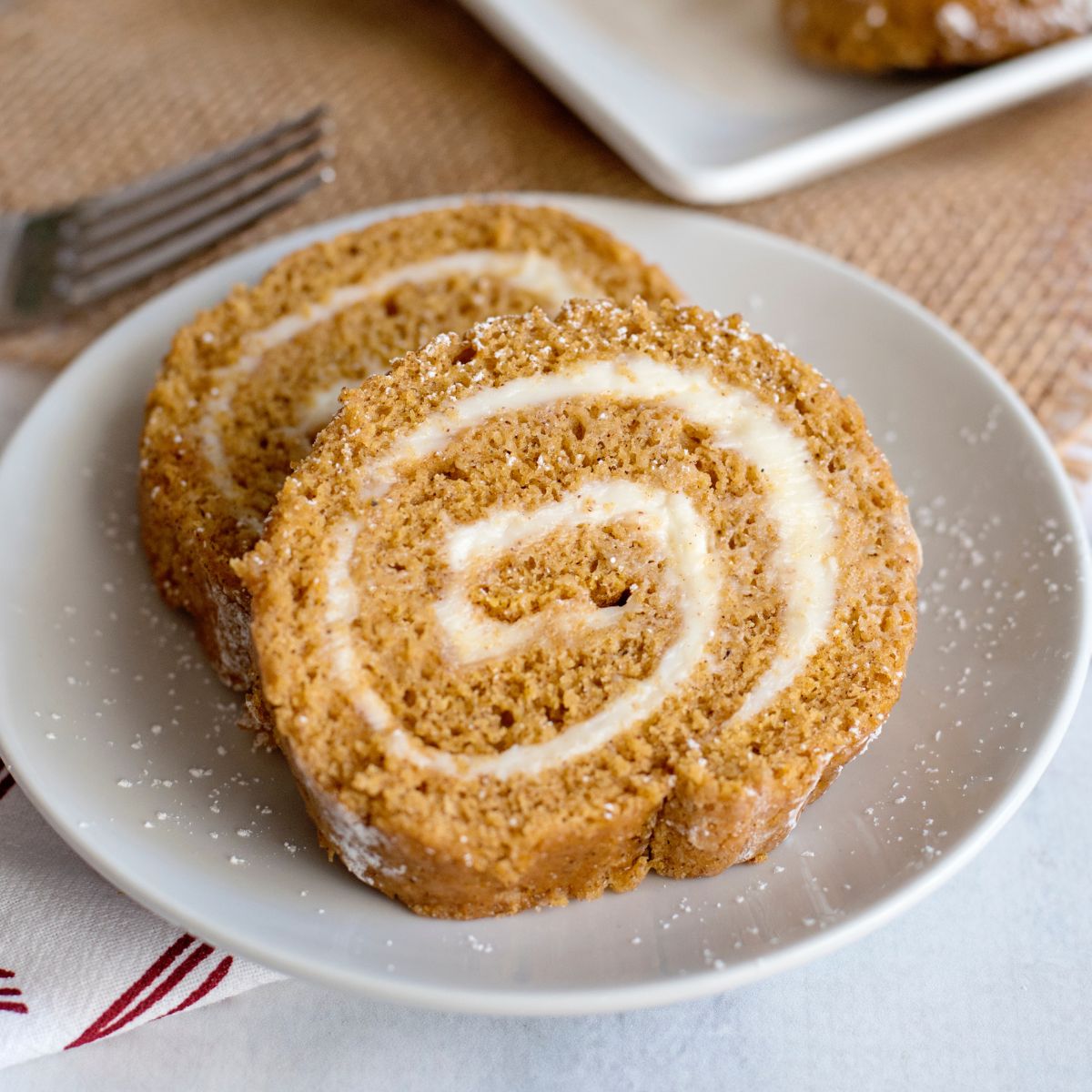 slices of pumpkin roll on a white plate