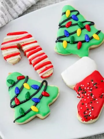 Christmas tree, bootie and candy cane cookies decorated.
