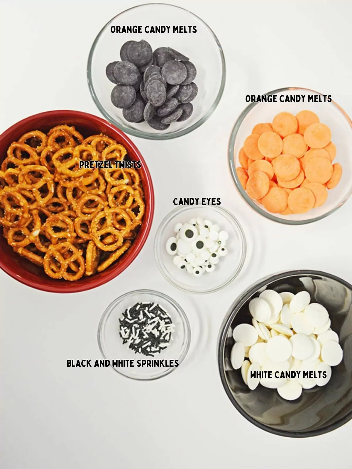 ingredients for chocolate covered pretzels in bowls.