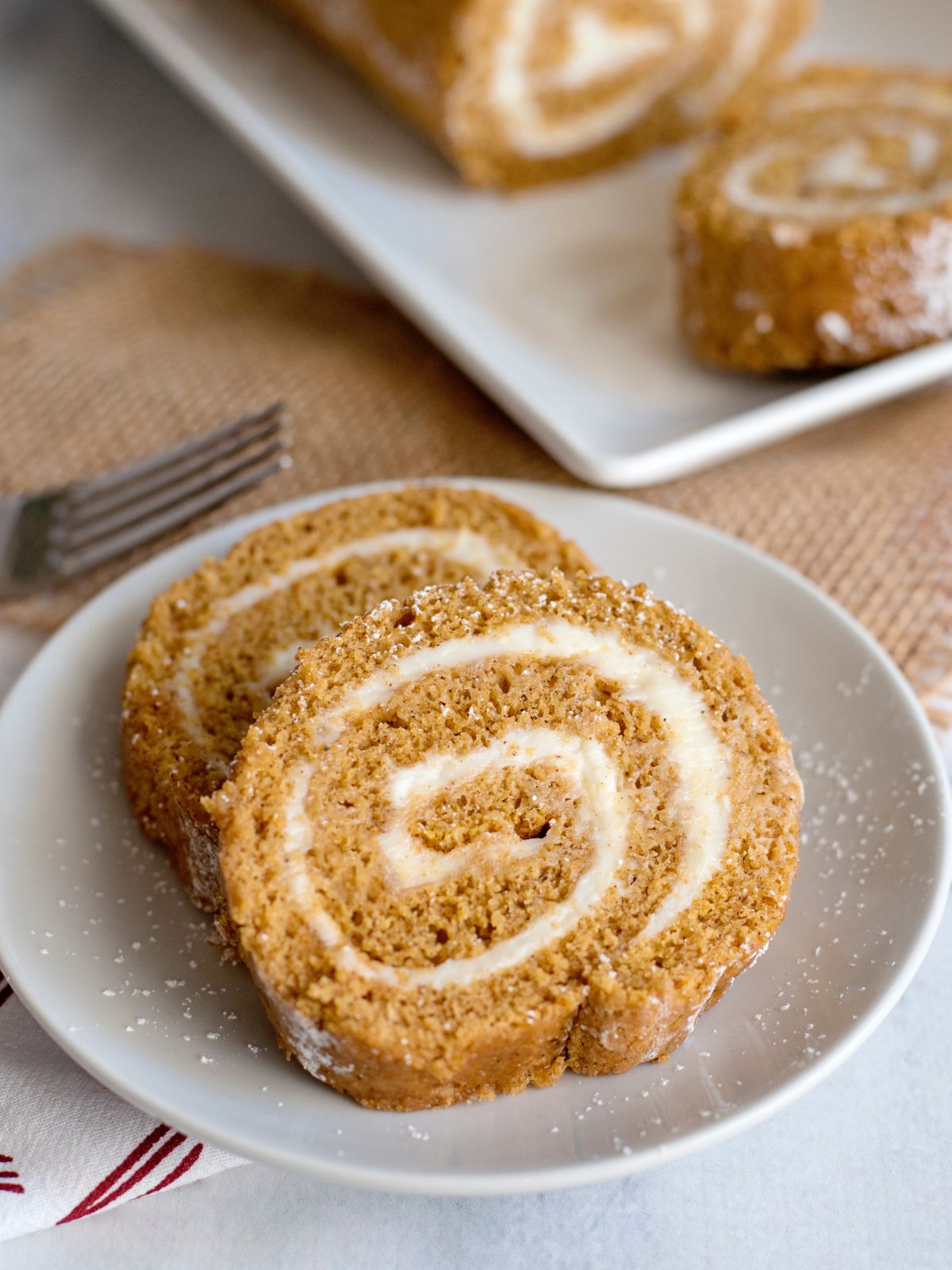 sliced pumpkin roll on plate.