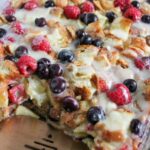 baked breakfast casserole with serving utensil.