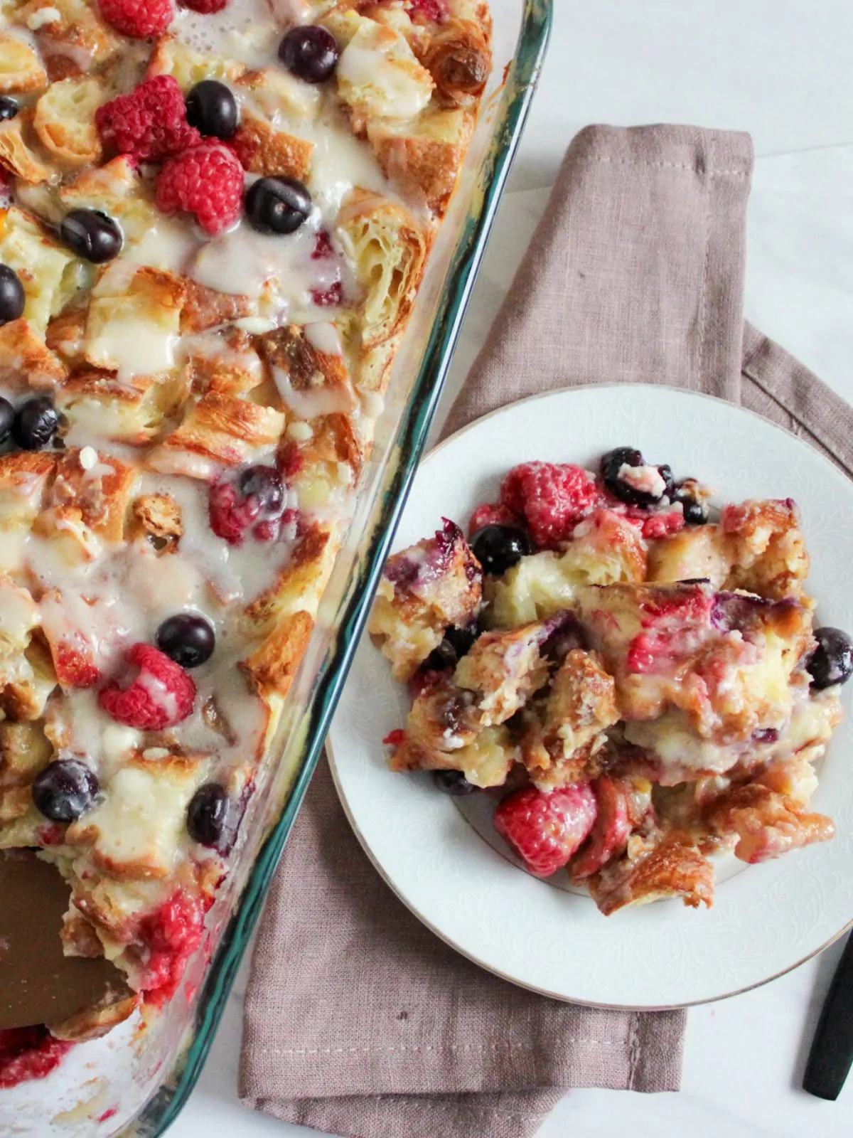 breakfast casserole served on plate with casserole dish.