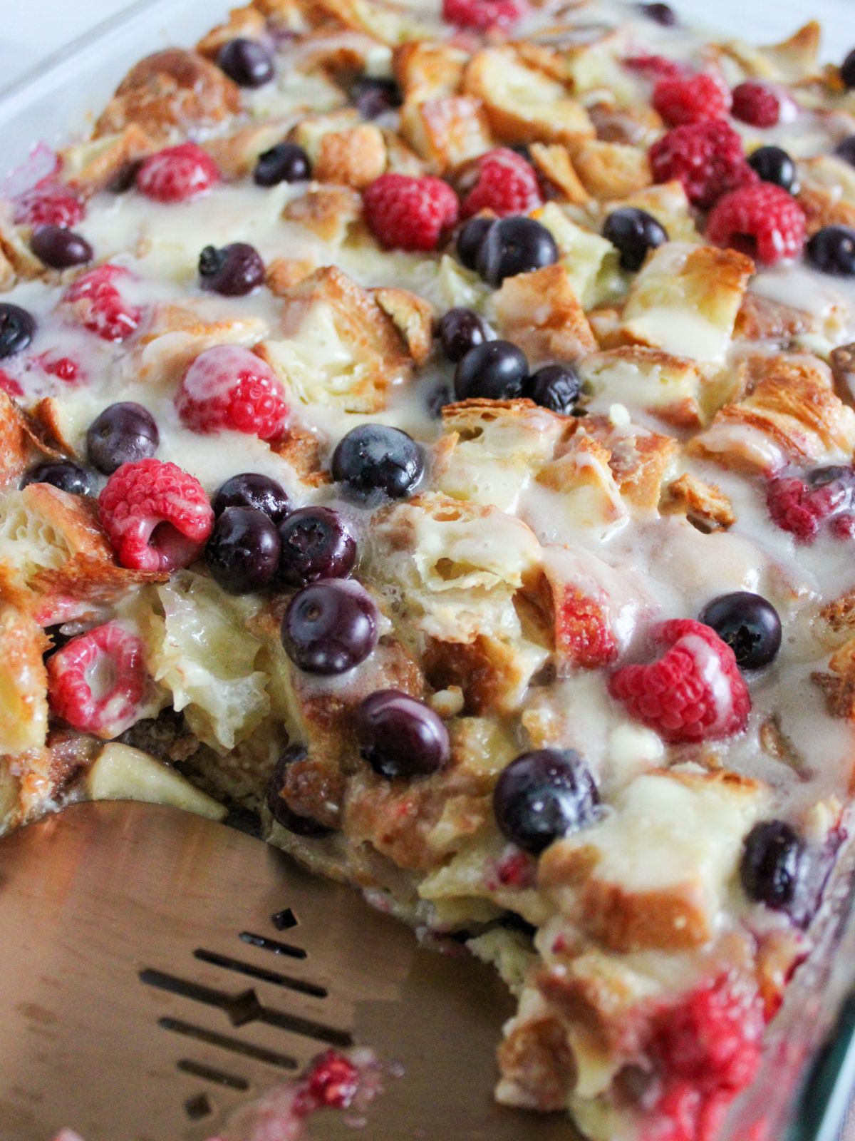 baked breakfast casserole with serving utensil.