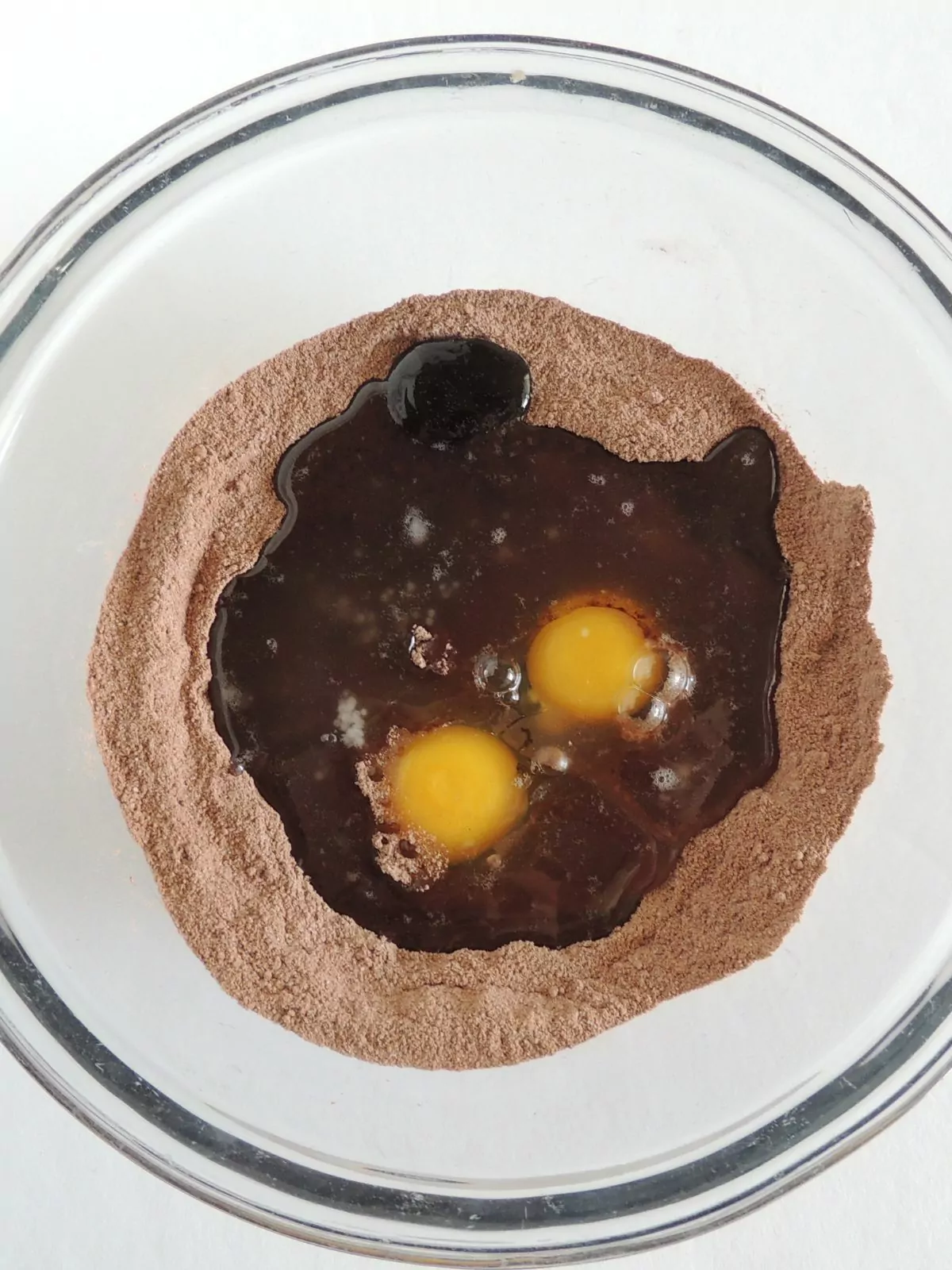 brownie mix with eggs and water in bowl.