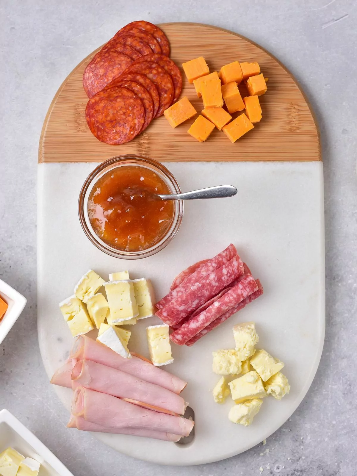 cheese board platter with salami, ham and chutney.