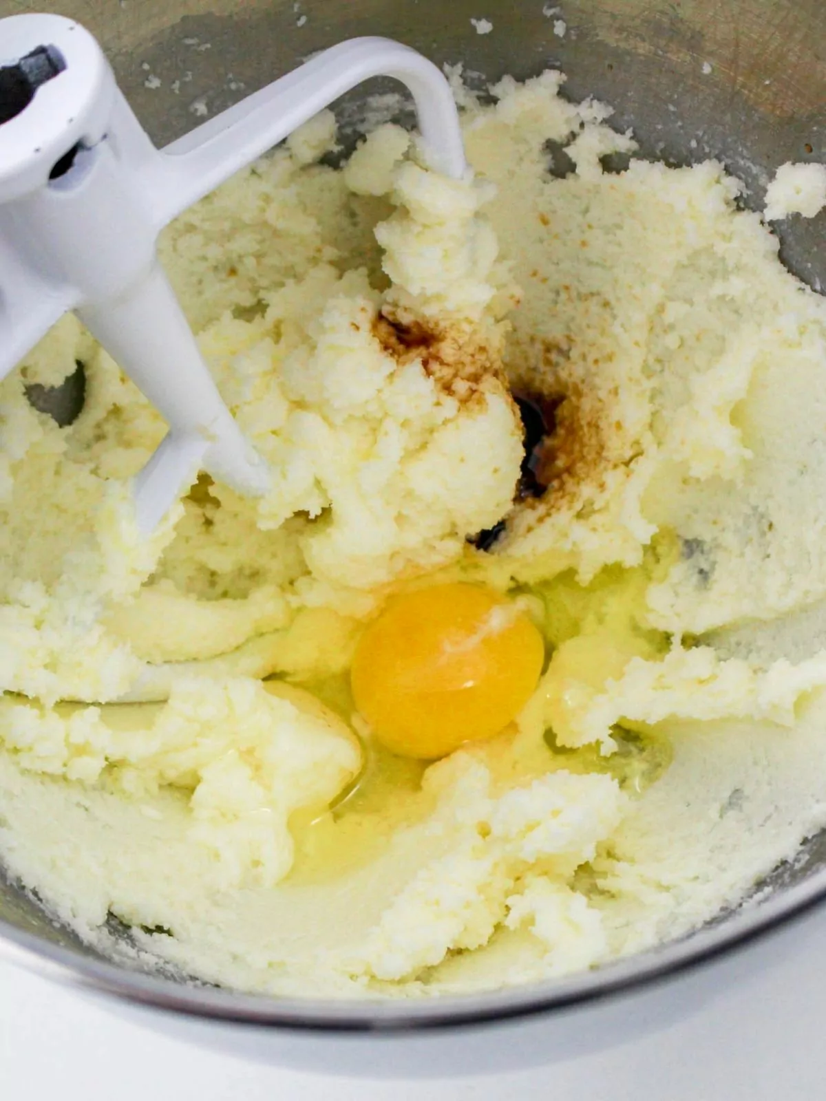Combine butter with sugar and eggs in mixing bowl.