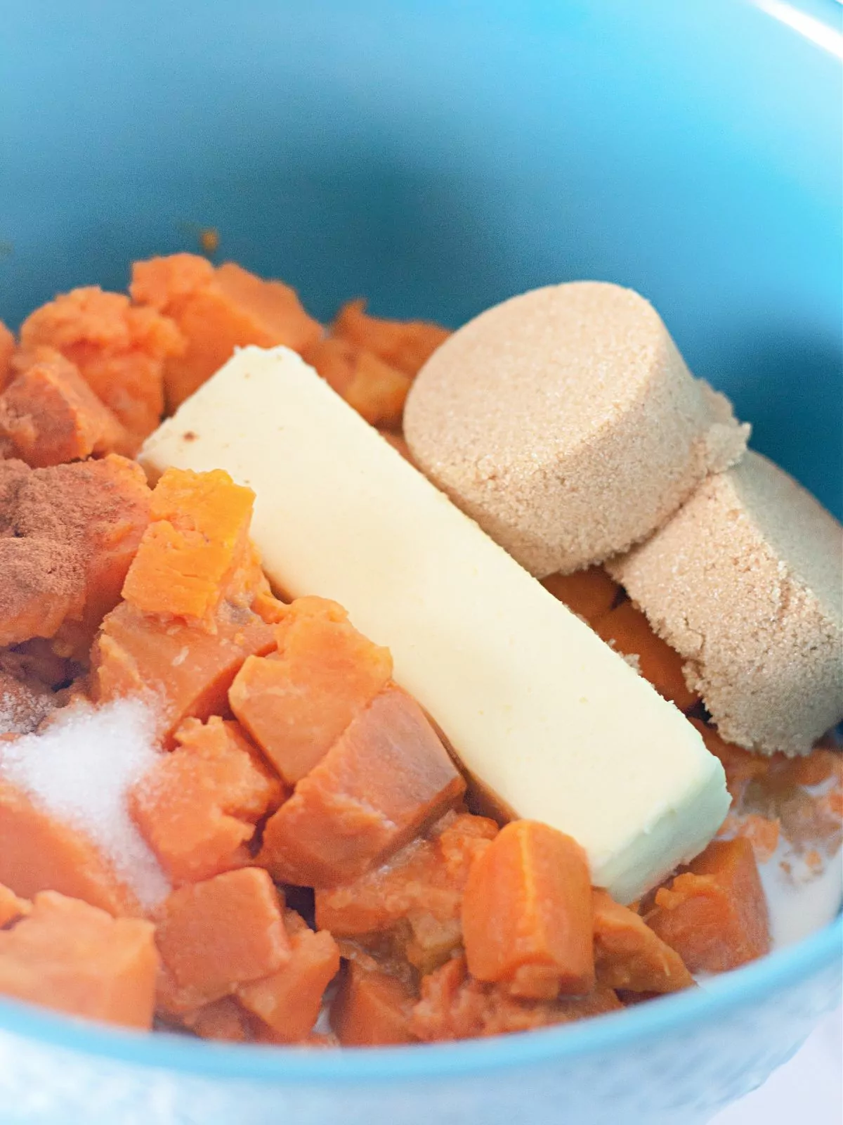 sweet potatoes with casserole ingredients in bowl.