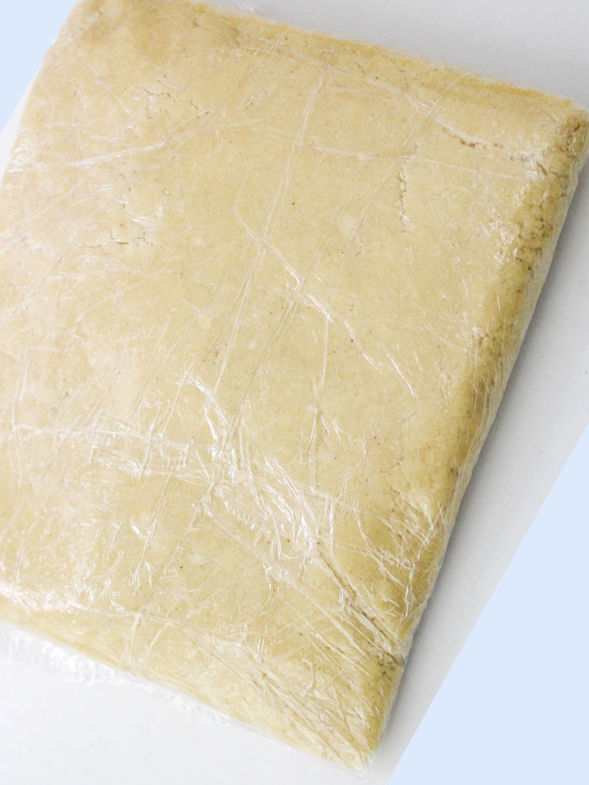 wrapped sugar cookie dough in plastic wrap.