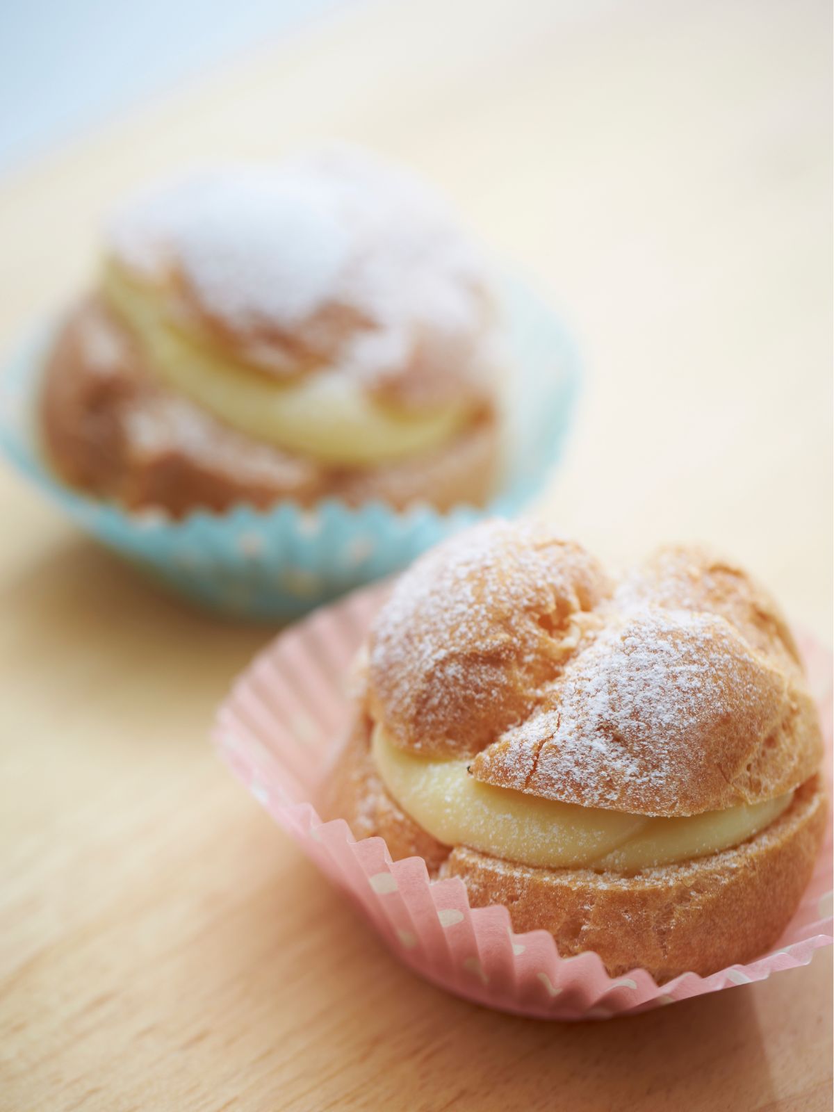 cream puffs ready to serve in paper muffin liners.