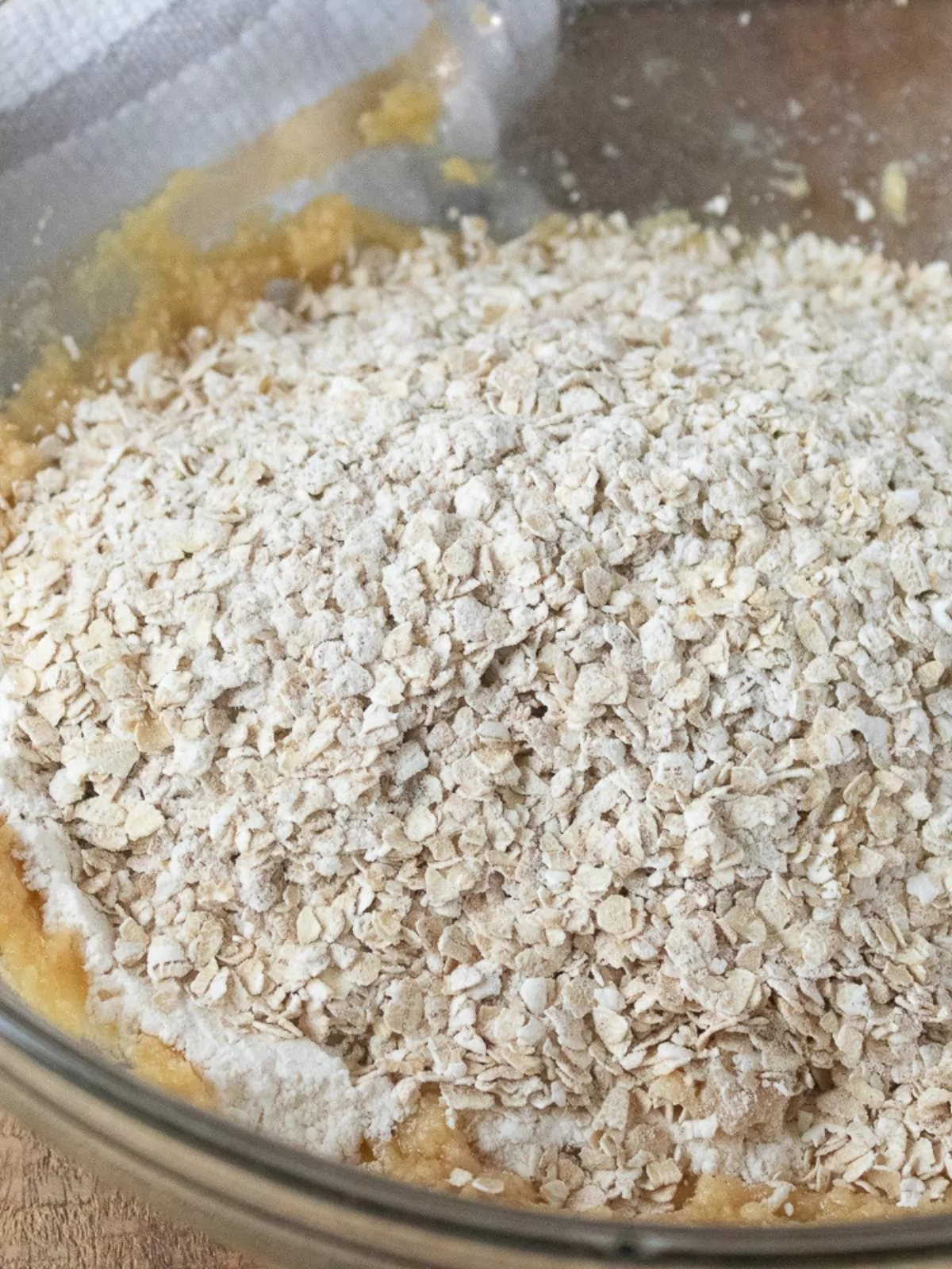 Add oatmeal to wet ingredients.