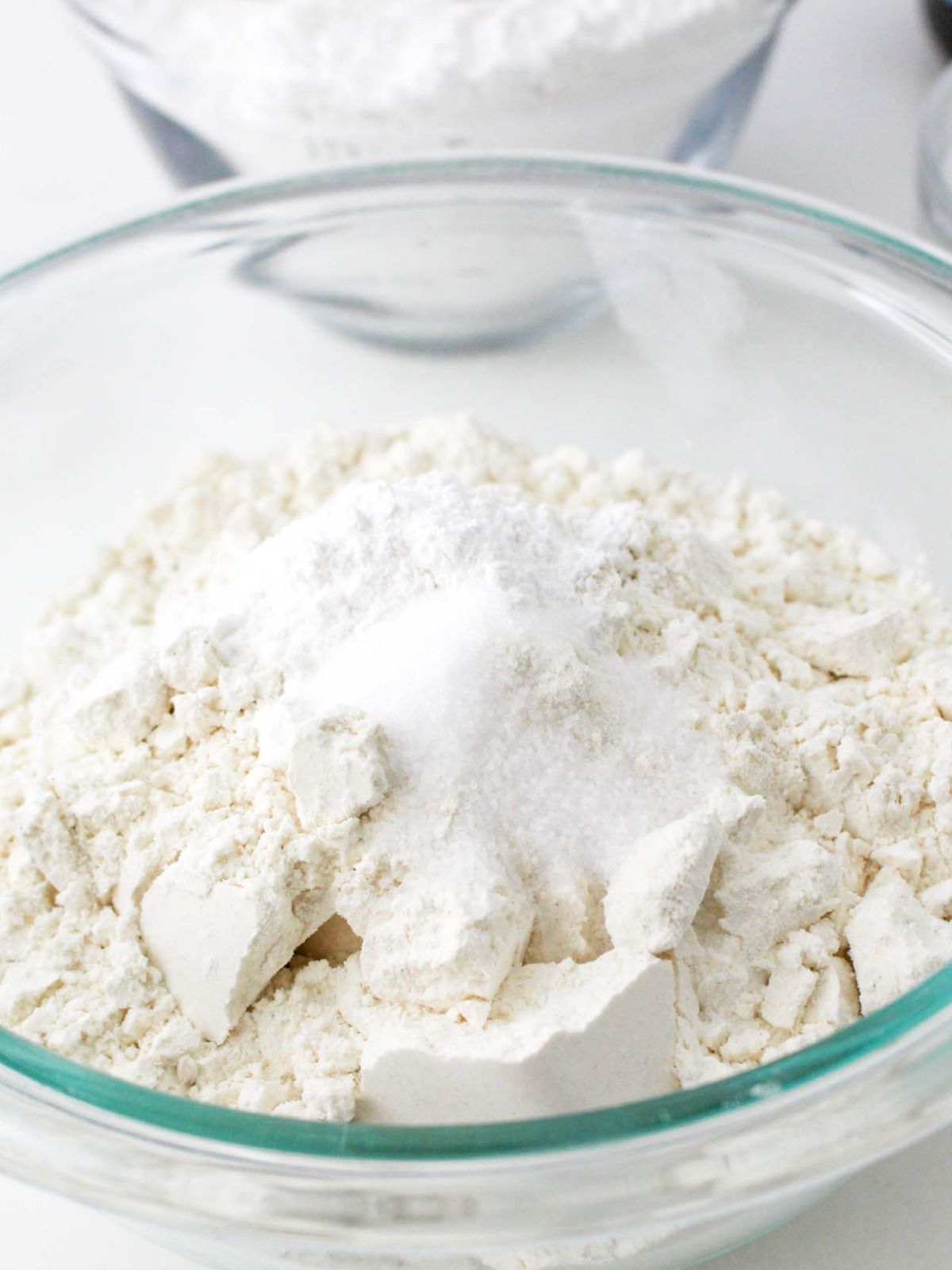 Dry ingredients for cookies in glass bowl.