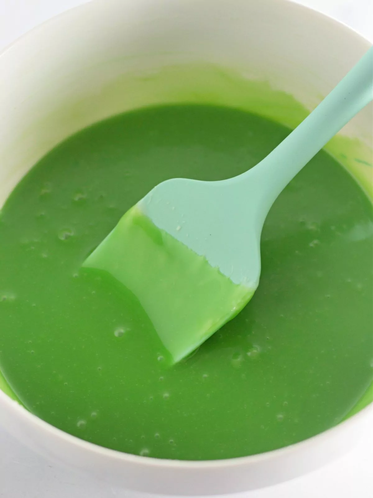 green frosting in bowl.