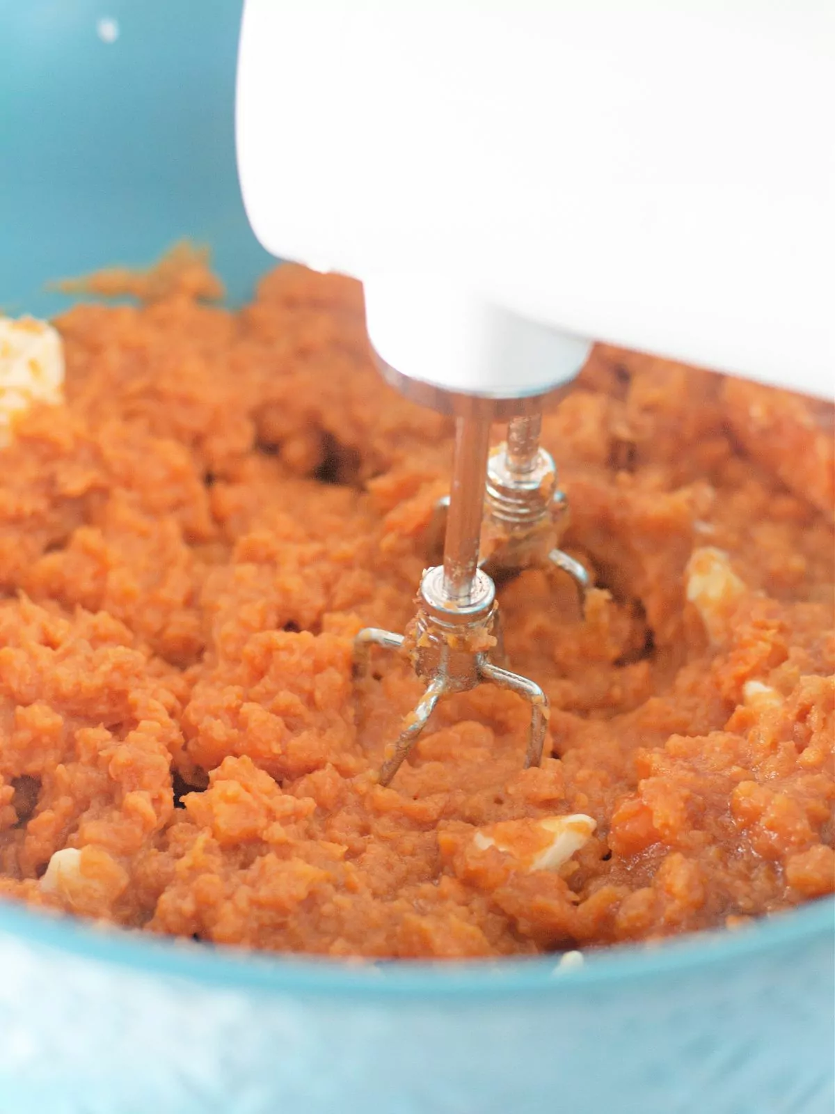 mashed sweet potatoes with electric mixer.