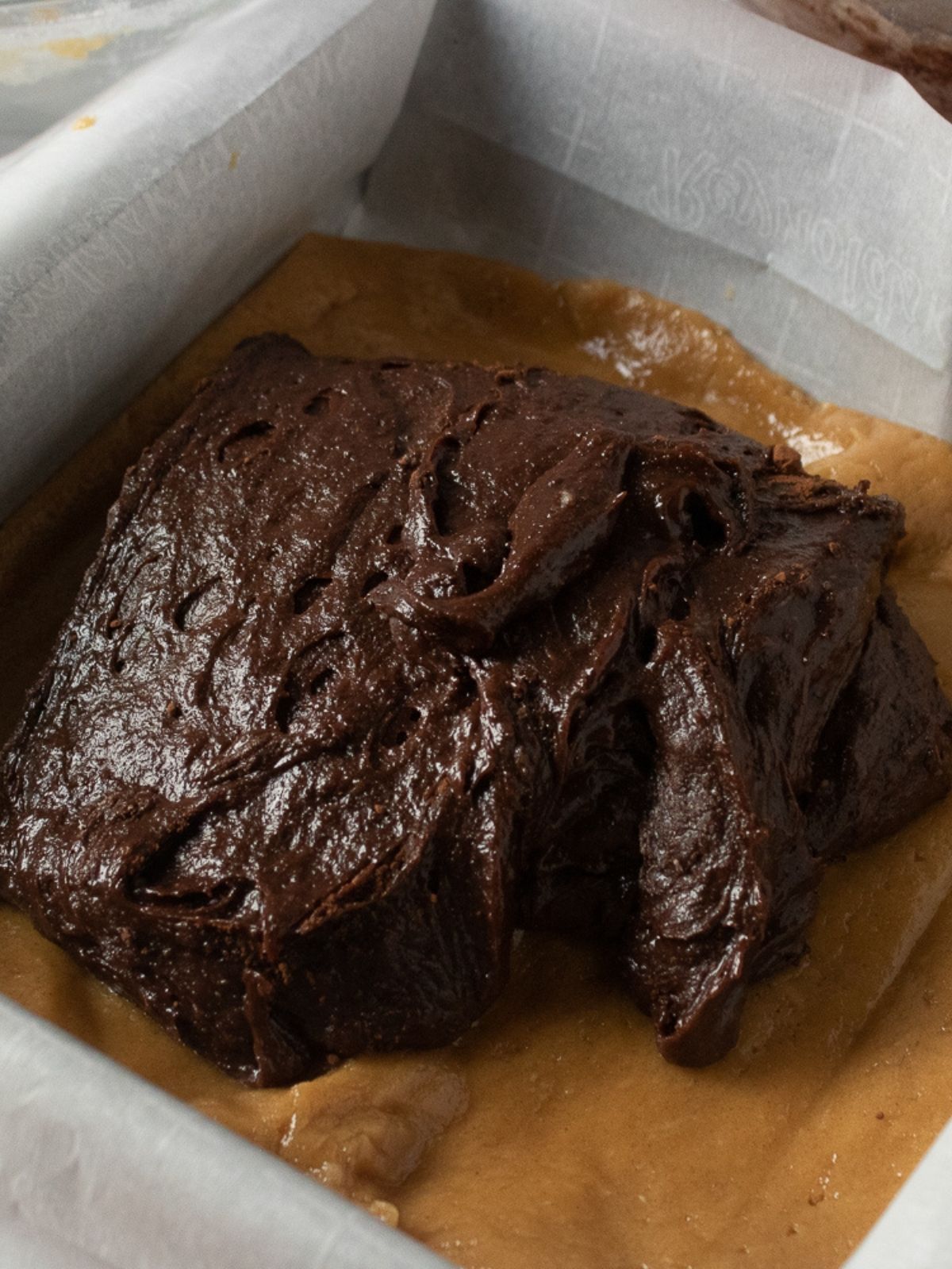 Spread chocolate layer on top of peanut butter layer.