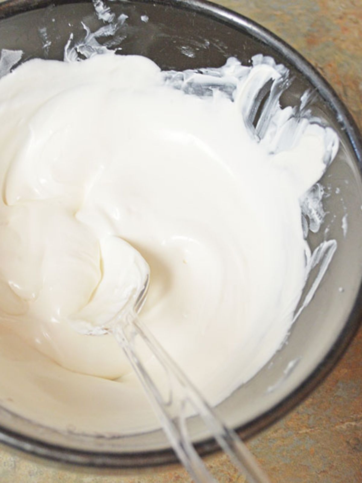 white melted chocolate in a bowl.