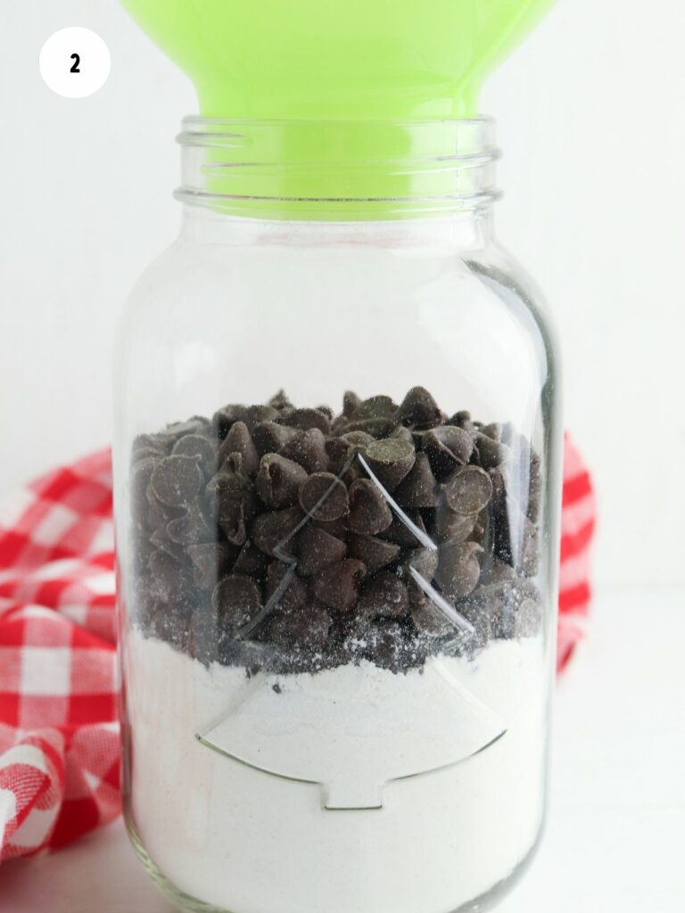green funnel with ingredients for chocolate chip cookies.