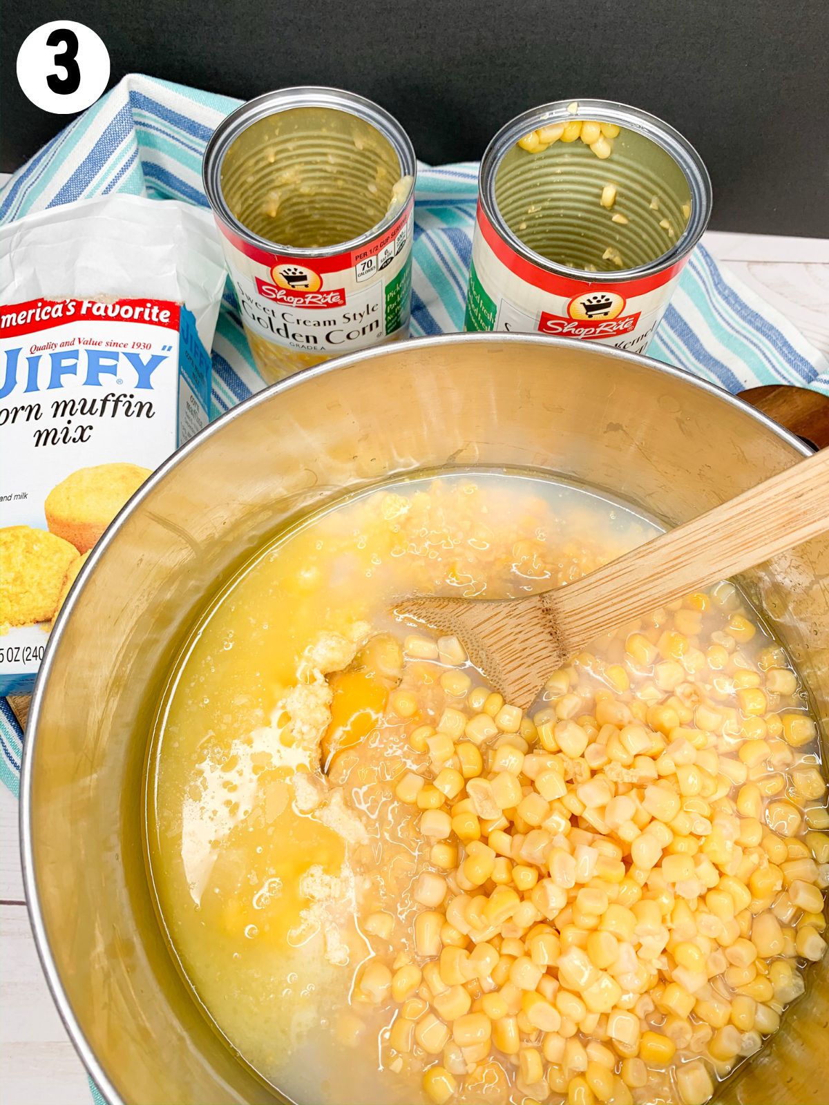 Add canned corn to bowl.