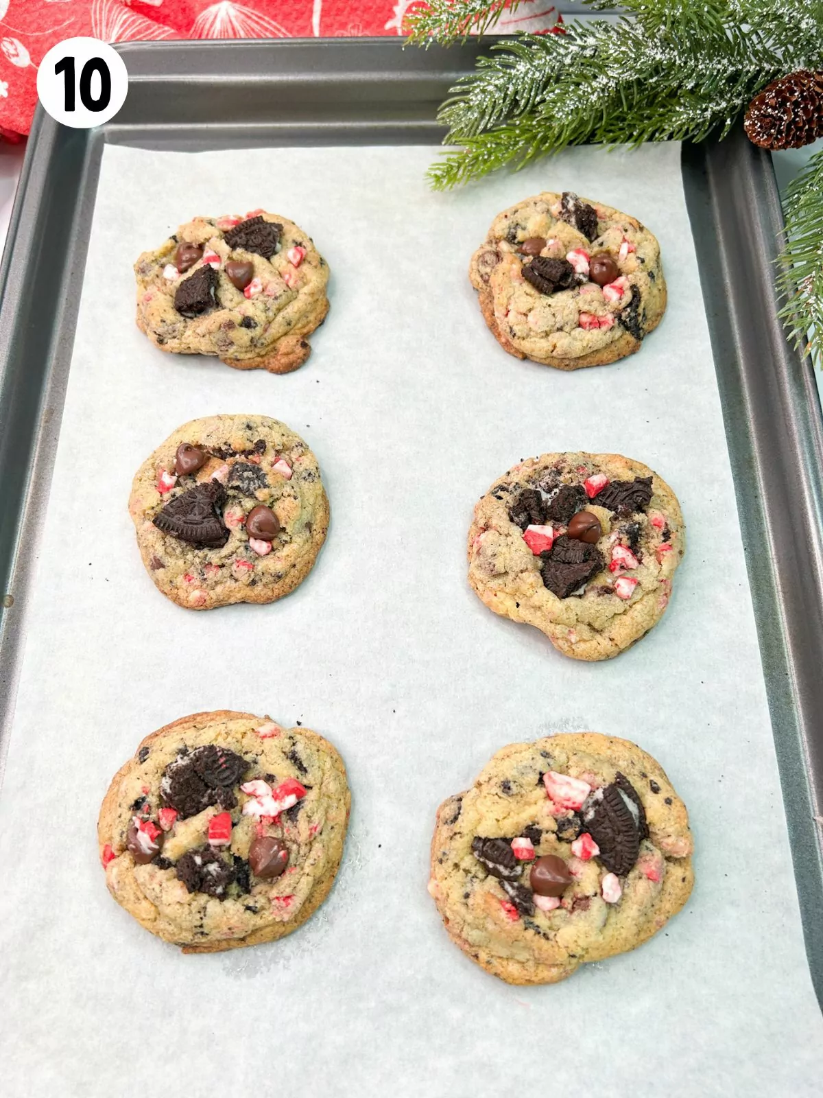 Baked cookies on tray with parchment paper.