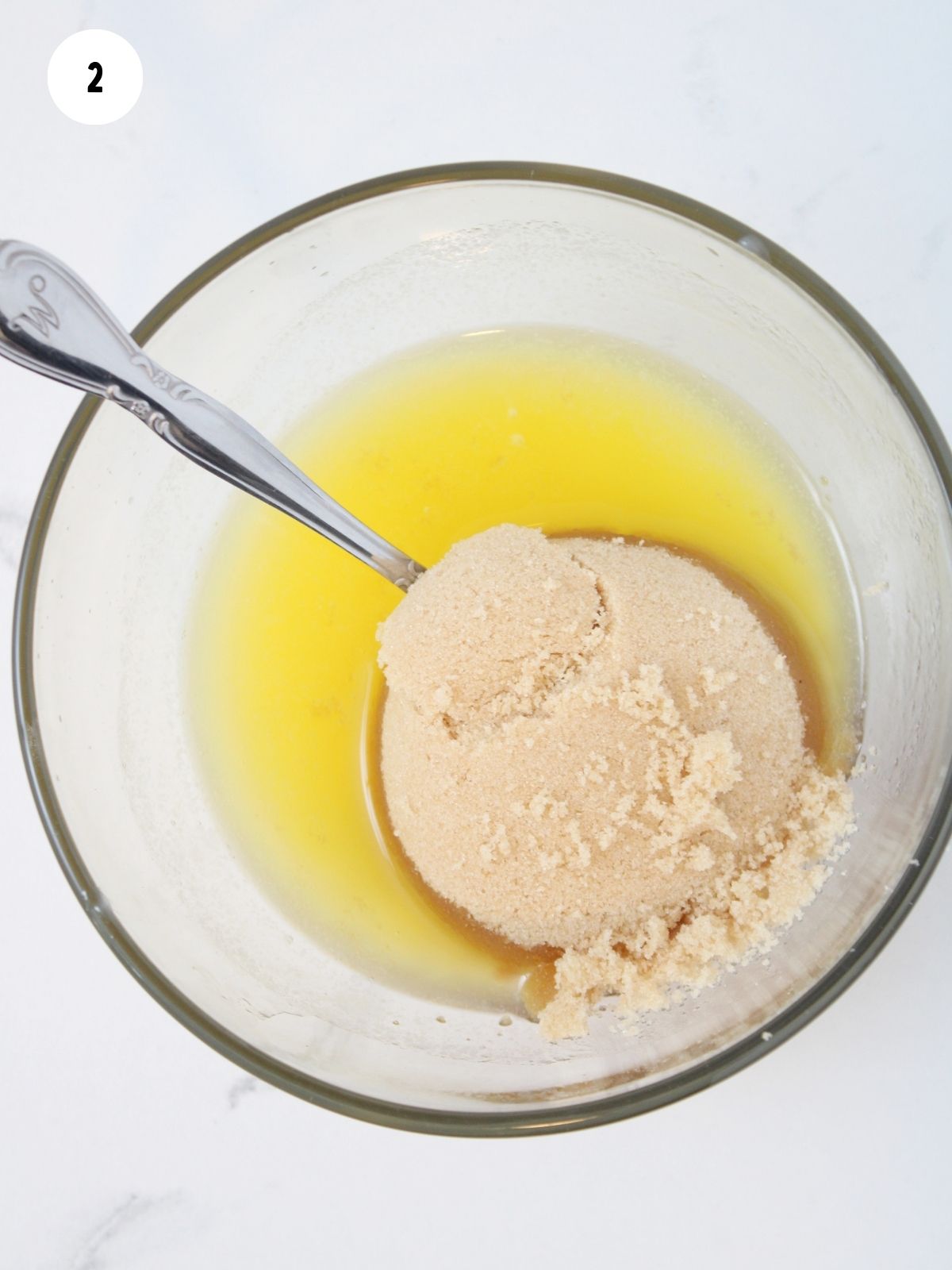 butter sugar mixture in bowl with spoon.
