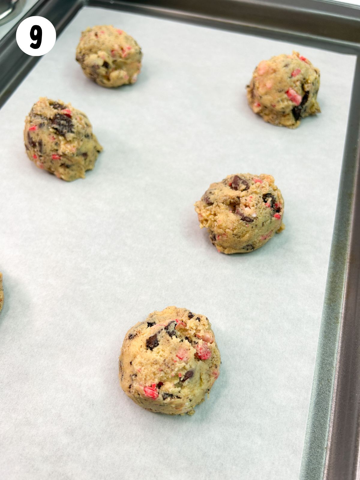 cookie dough balls on baking tray.