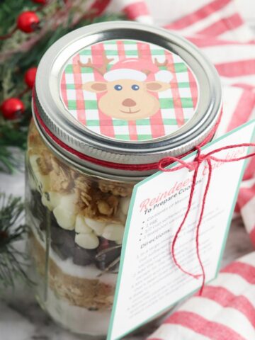 Reindeer cookies in a jar with label and red twine.