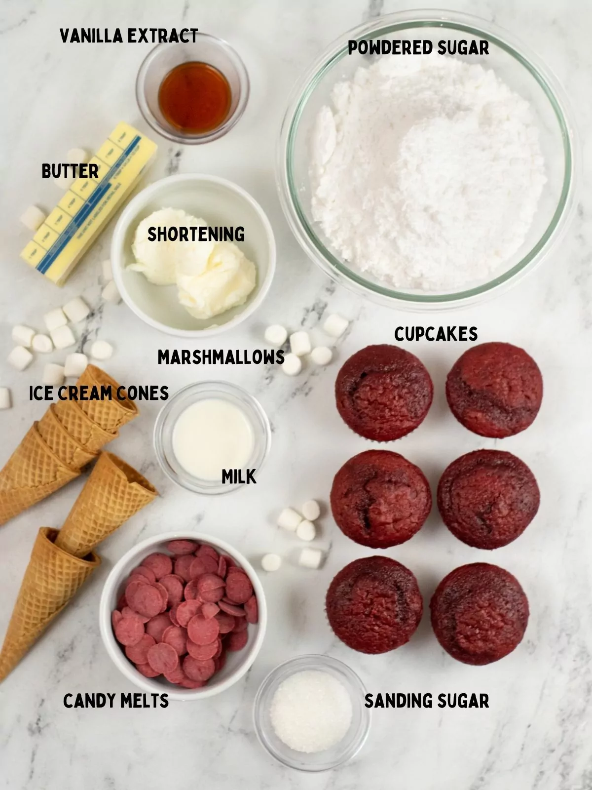 Ingredients for Santa hat cupcakes made with ice cream cones and red candy melts.