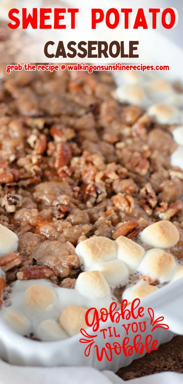 Sweet Potato Casserole with pecans and marshmallows in casserole dish baked.