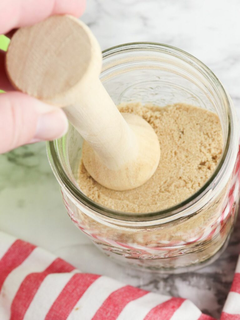 Pack ingredients together using a tamper tart tool.