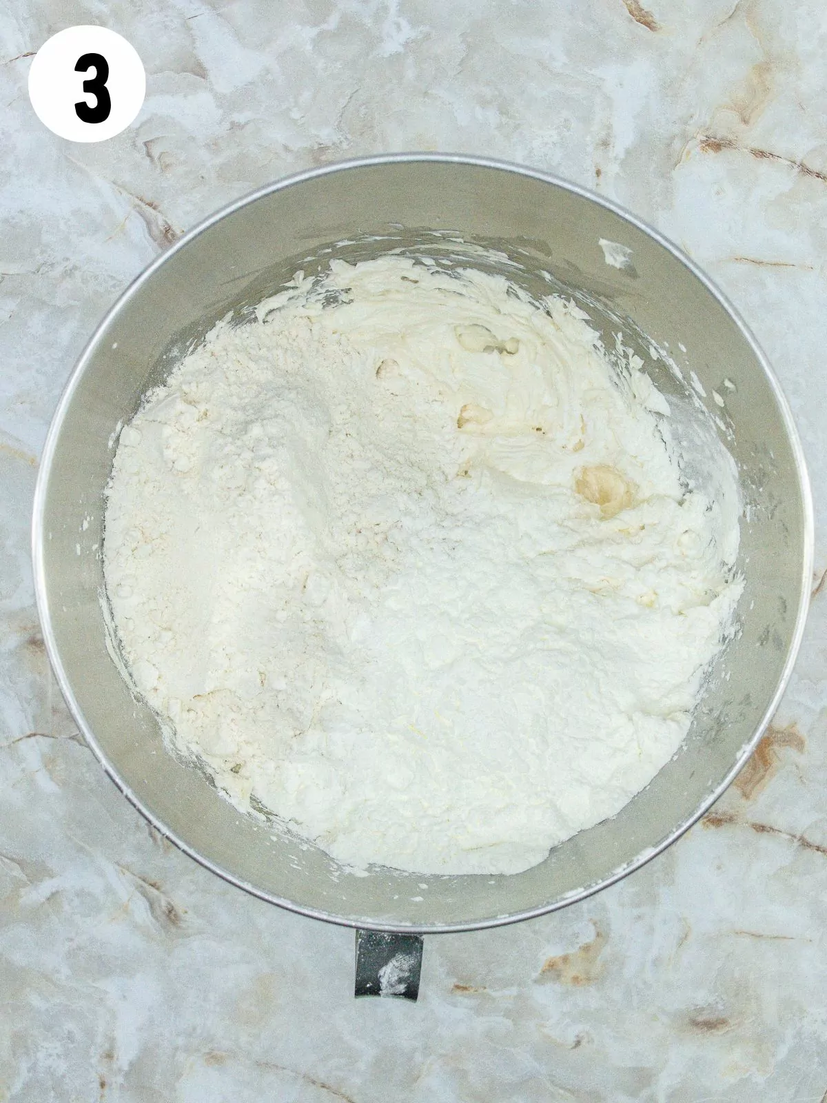 flour added to butter mixture in bowl.