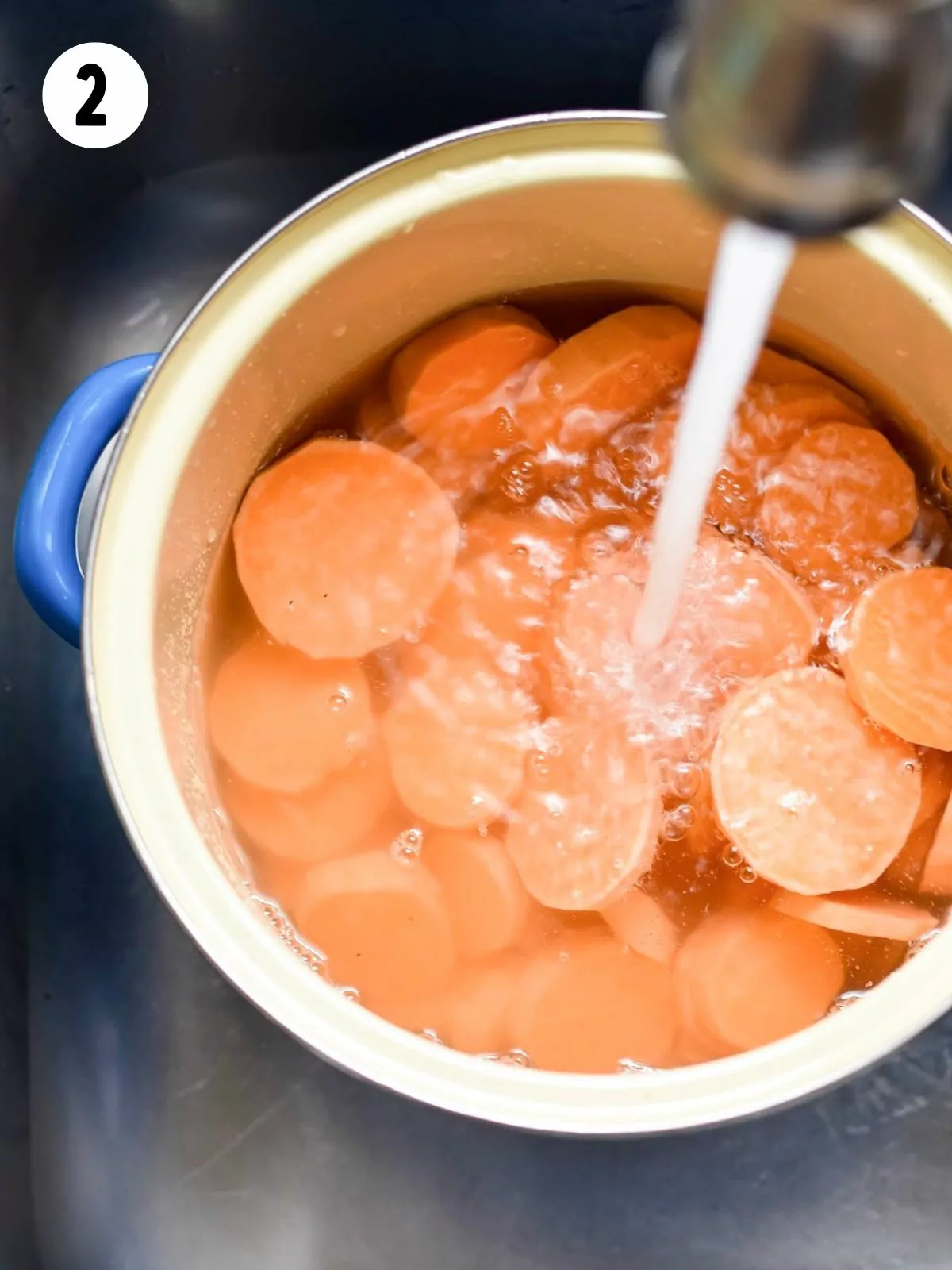 sweet potato slices in pot of water.