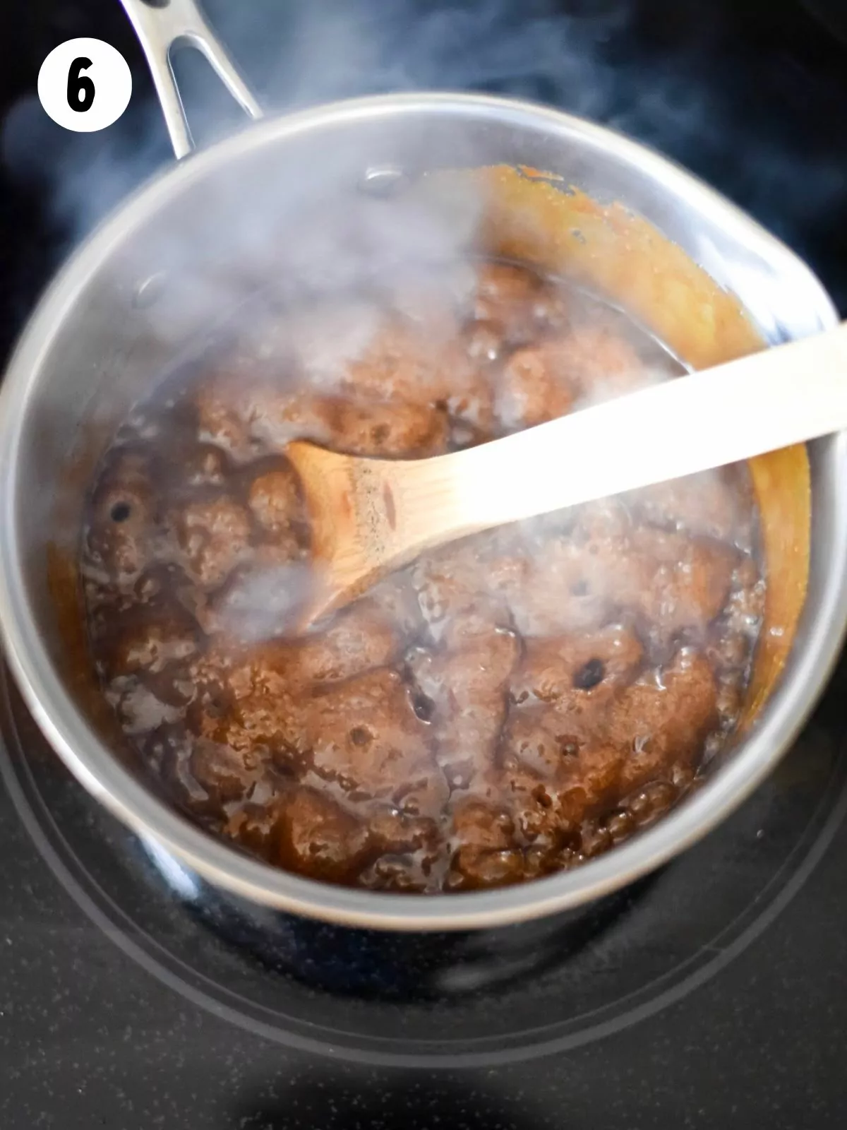 butter and brown sugar mixture boiling in saucepan.