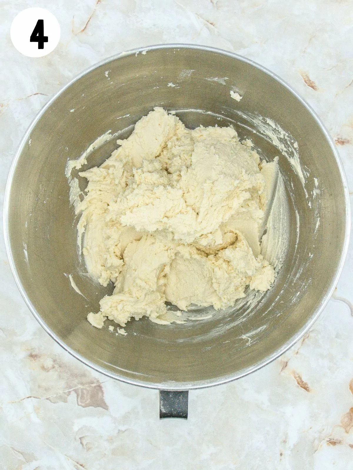 Christmas shortbread cookie dough combined in bowl.