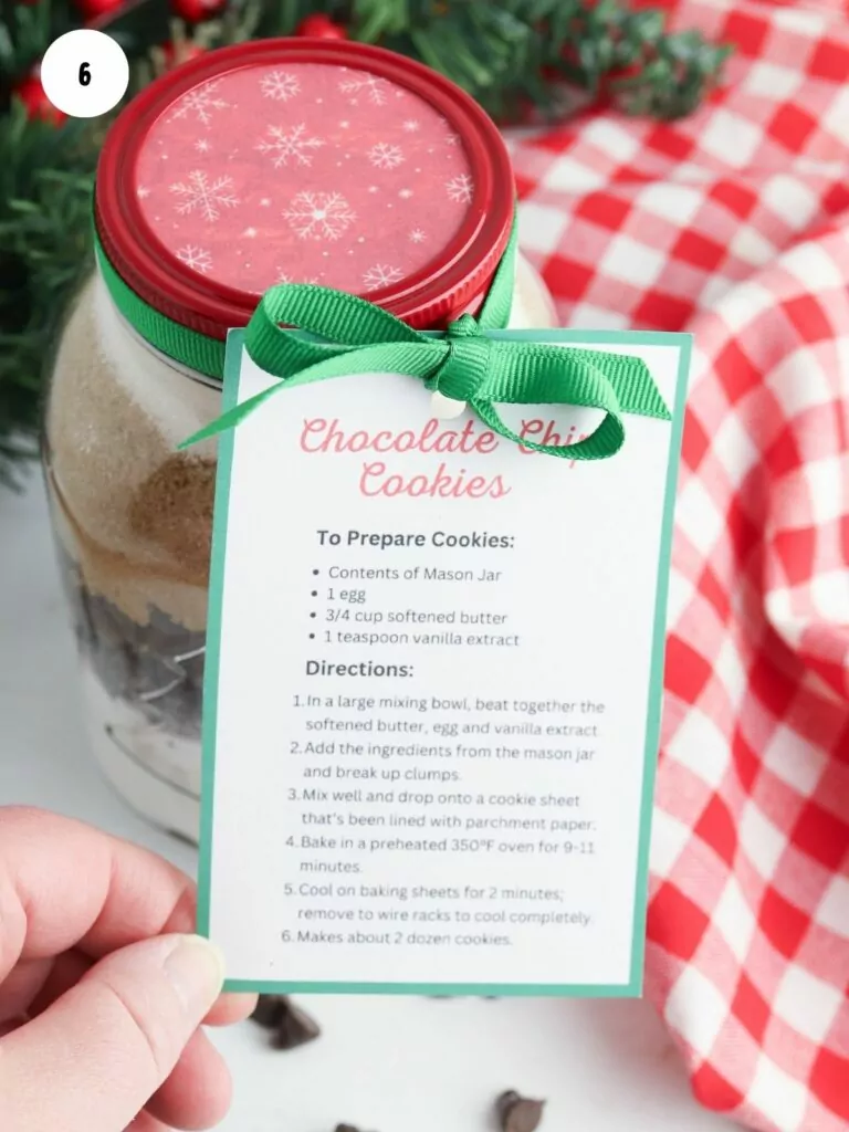 gift tag attached to mason jar with cookie ingredients.