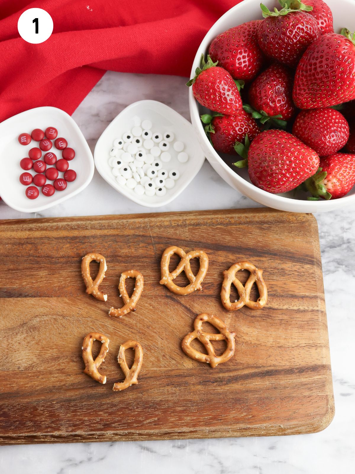broken pretzel pieces on cutting board.