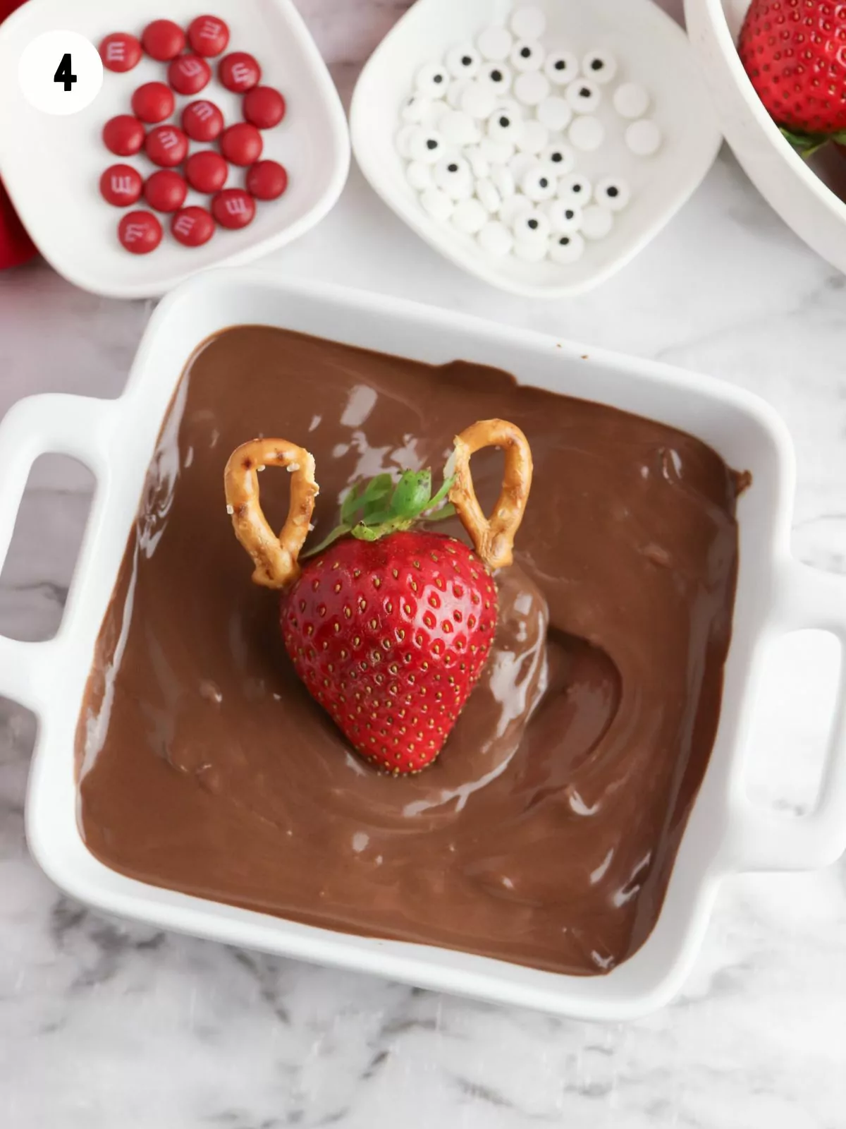 Dip strawberries in melted chocolate.