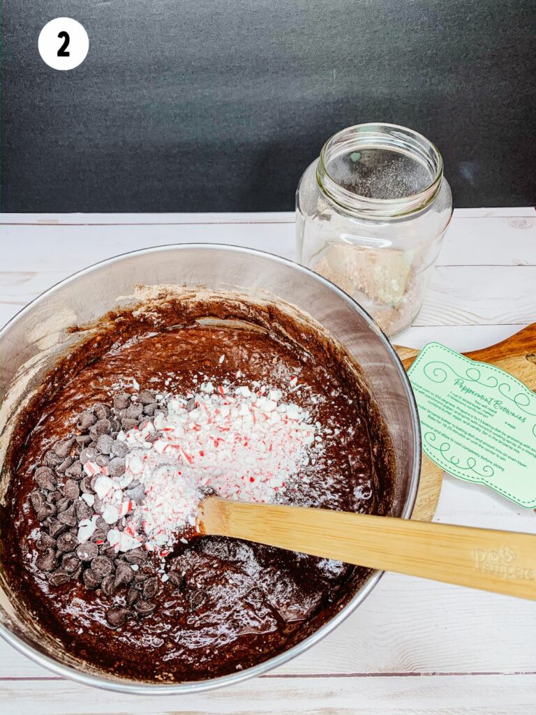 Add peppermint and chocolate chips to brownie batter.