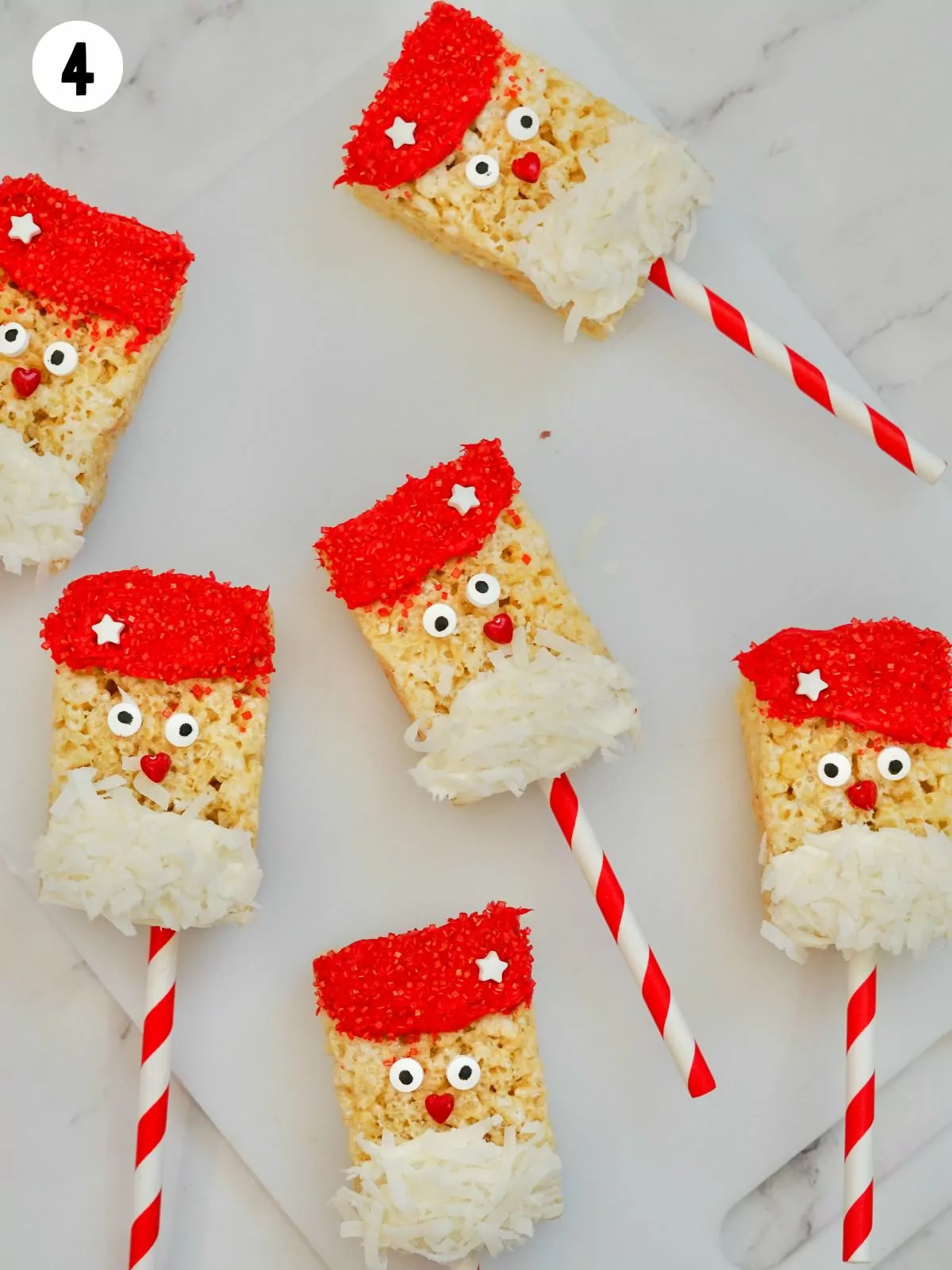 Rice krispie treats decorated to look like Santa.